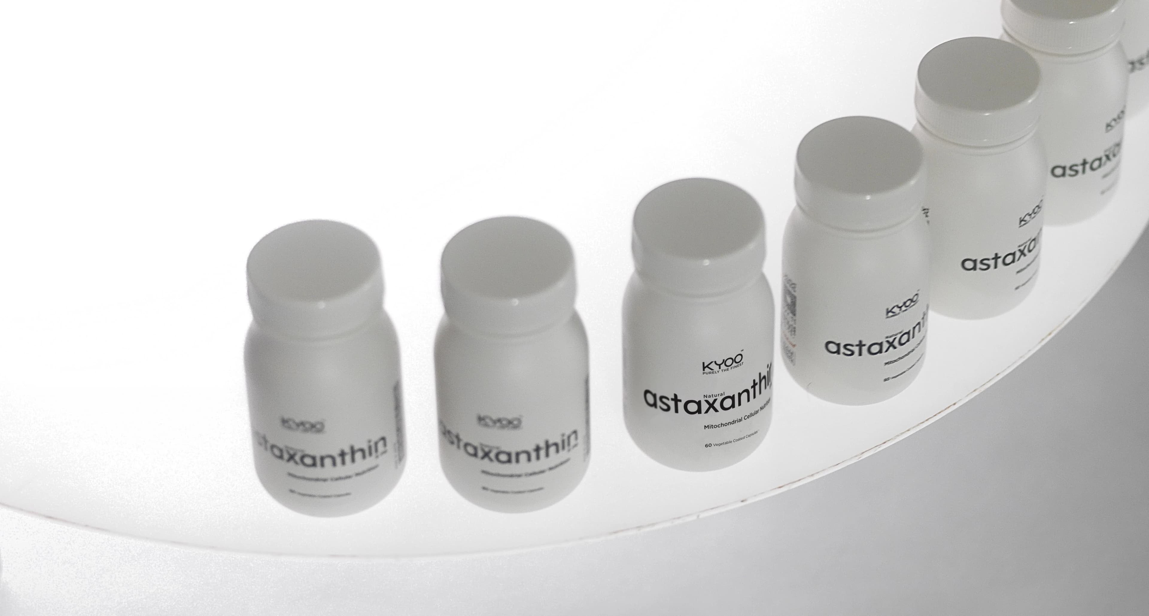 KYOO natural astaxanthin bottles arranged in a studio